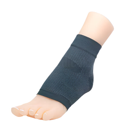 Image of foot wearing the Matrix Compression Foot Sleeve in charcoal, showing discreet support for plantar fasciitis and Achilles tendonitis