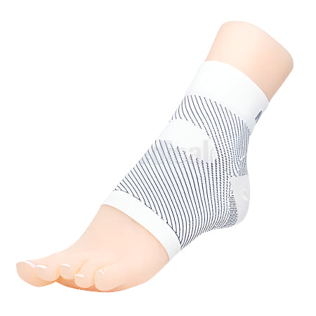 Image of foot wearing the Matrix Compression Foot Sleeve in White showing low-profile design for plantar fasciitis relief.