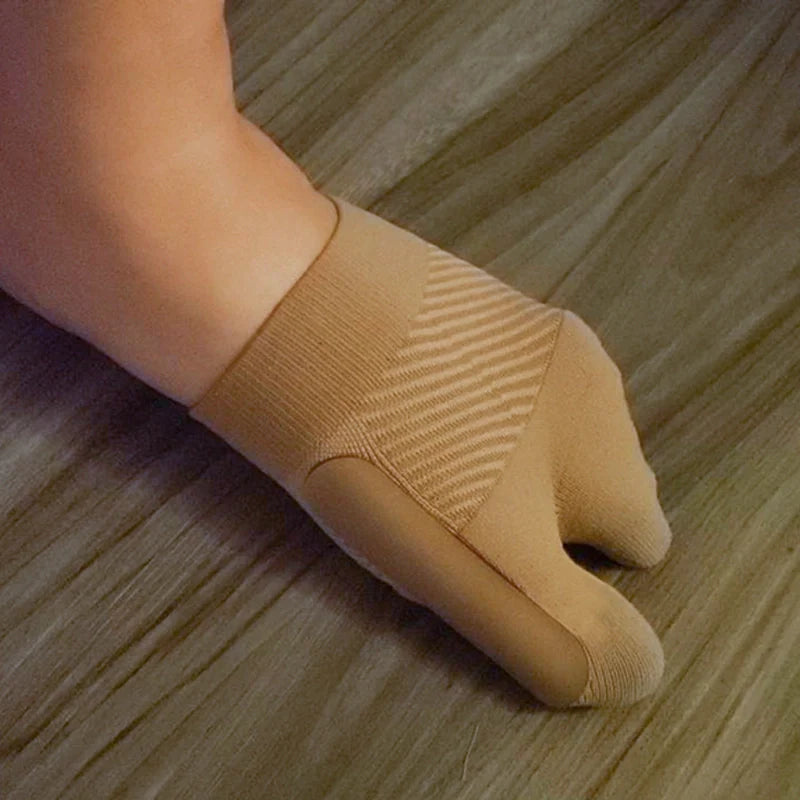 Left foot wearing OS1st HV3 Bunion Bracing Sleeve providing targeted compression and support for bunion pain relief, designed to improve foot alignment and mobility.