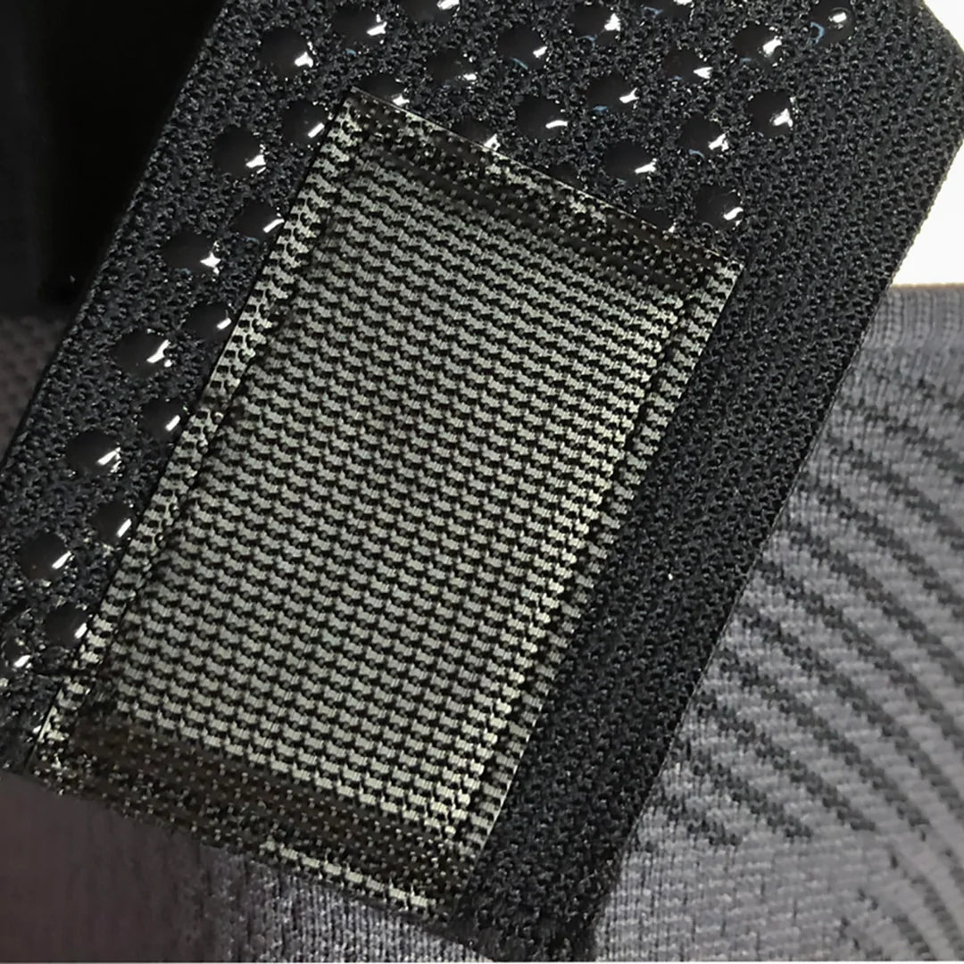 Close up of the adjustable top end of the OS1st KS7+ Adjustable Performance Knee Sleeve in black, offering targeted compression for knee pain relief and support, designed to improve mobility during activity.