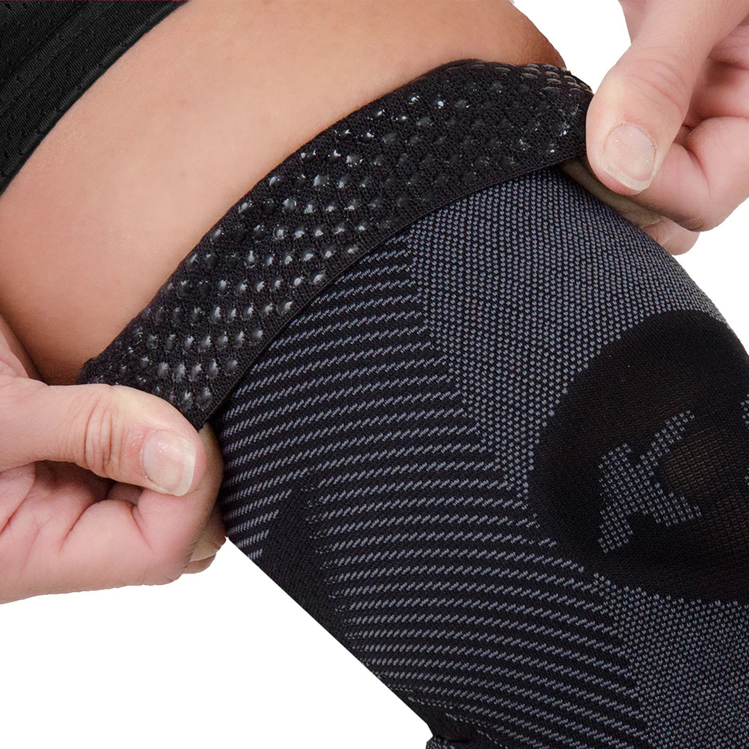 Close up of gel grip top on the underside of the OS1st KS7 Performance Knee Sleeve in black, offering targeted compression to support knee pain relief, improve mobility, and enhance performance during physical activity.