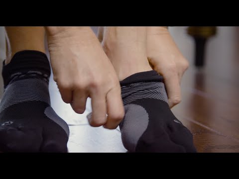 Video on how to wear OS1st BR4 Bunion Relief Socks in black, designed with targeted compression to alleviate bunion pain and provide comfort and support for improved mobility.